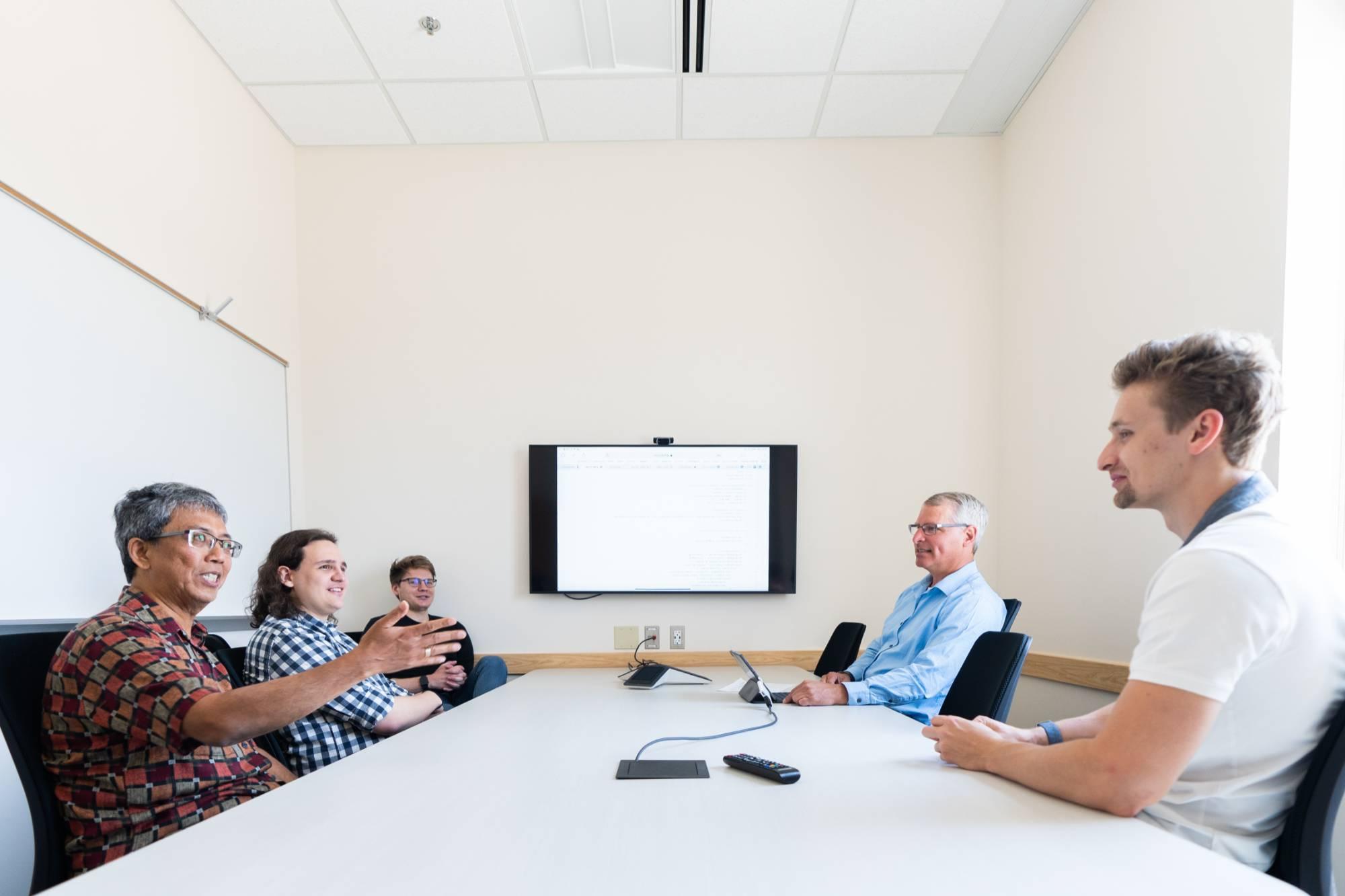 people sitting at conference table